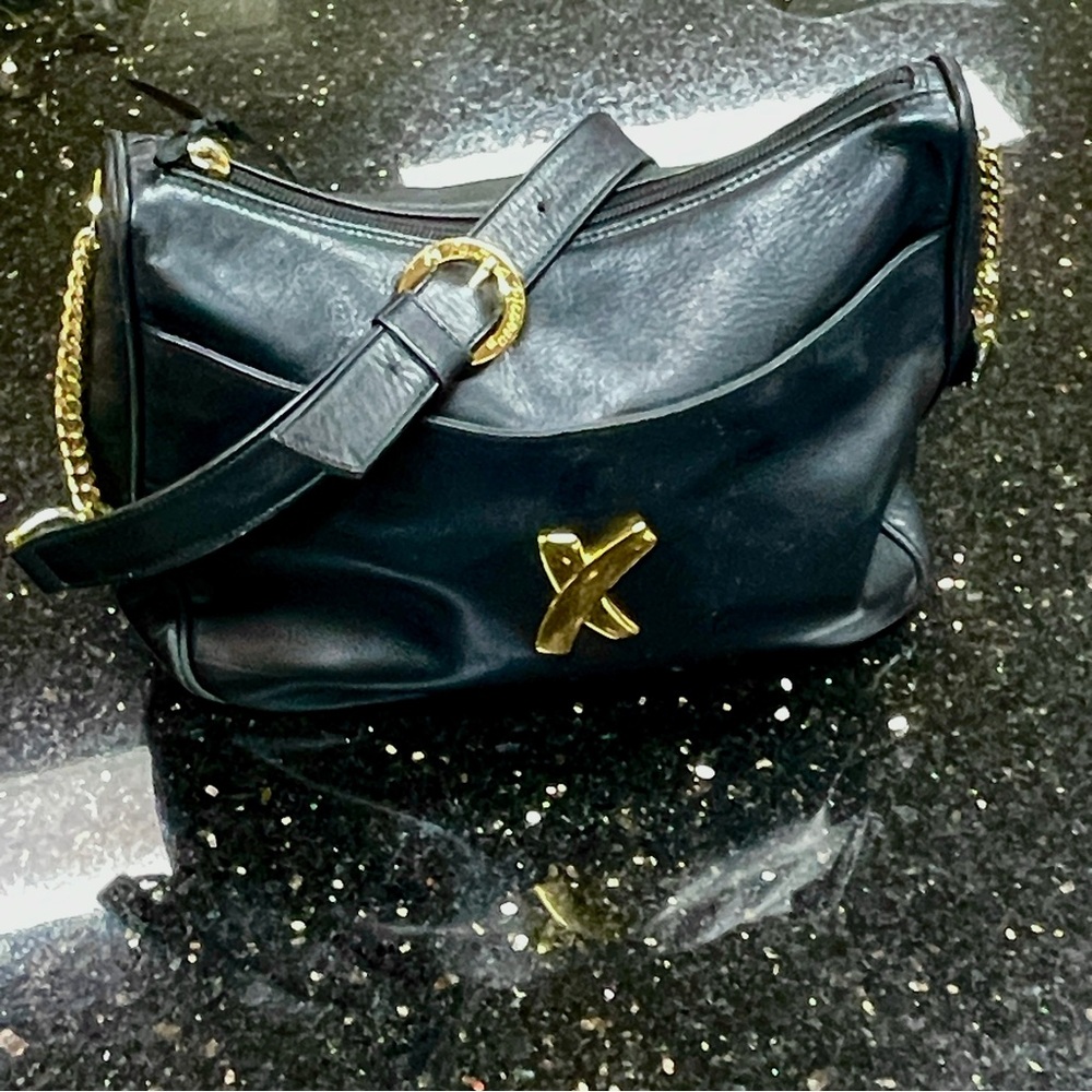 Picasso Paloma Black Leather Shoulder Bag with Gold accents.